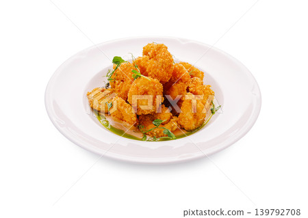Crispy shrimp served on a white plate with herbs for garnish Crispy shrimp served on a white plate with herbs for garnish 139792708