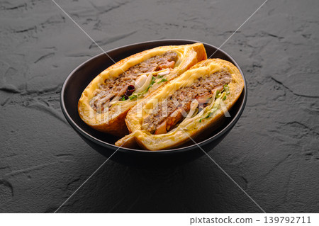 Cheesy bread roll with beef and vegetables served in a bowl Cheesy bread roll with beef and vegetables served in a bowl 139792711