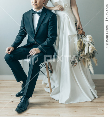 A bride and groom having their pre-wedding/photo wedding photos taken at a studio (bridal/wedding) A bride and groom having their pre-wedding/photo wedding photos taken at a studio (bridal/wedding) 139793280