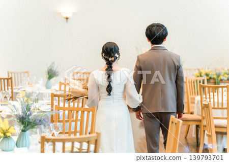 Bride and groom entering and leaving the wedding ceremony and reception Bride and groom entering and leaving the wedding ceremony and reception 139793701