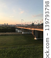 A bridge crossing the Yodo River at dusk 139793798