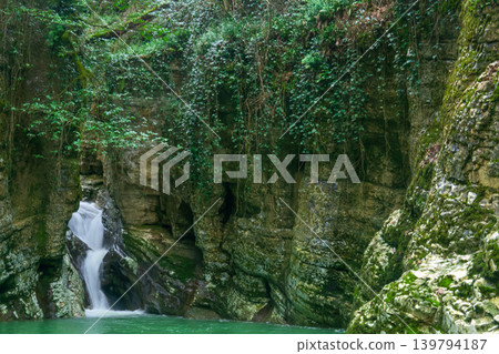 Waterfall in the green forest canyon Waterfall in the green forest canyon 139794187