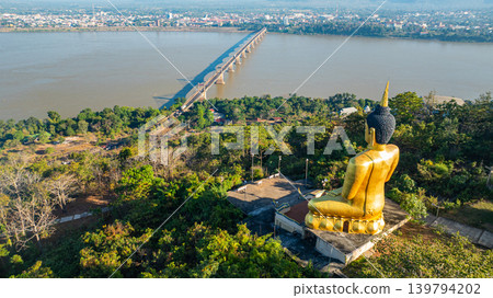 Wat Phousalao Big Buddha with Scenic View of Mekong River and Bridge Wat Phousalao Big Buddha with Scenic View of Mekong River and Bridge 139794202