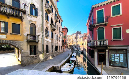 A morning scene in a residential area along a small canal in Venice. A morning scene in a residential area along a small canal in Venice. 139794666