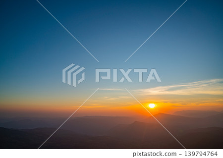 Aerial view of Golden Sky Over Nan Dramatic Ridge Road 139794764