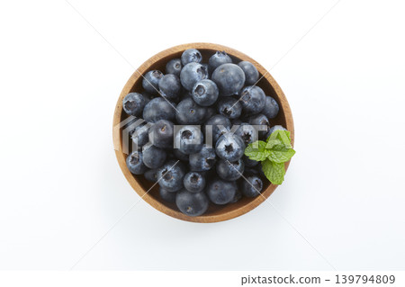 Lots of blueberries placed against a white background Lots of blueberries placed against a white background 139794809