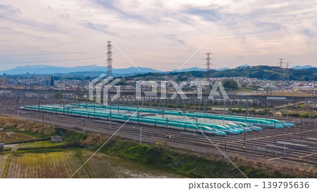 April 30 2026 Shinkansen trains parked at Sendai yard near suburban landscape 139795636