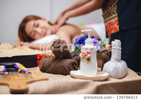 Woman relaxes during soothing back massage Woman relaxes during soothing back massage 139796023