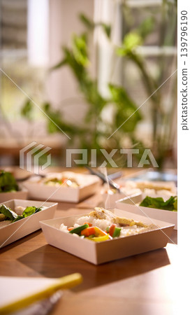 Hot lunch with chicken rice and vegetables on office table Hot lunch with chicken rice and vegetables on office table 139796190