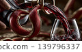 Charming sommelier gracefully serving vibrant red wine during intimate and elegant dining experience 139796337