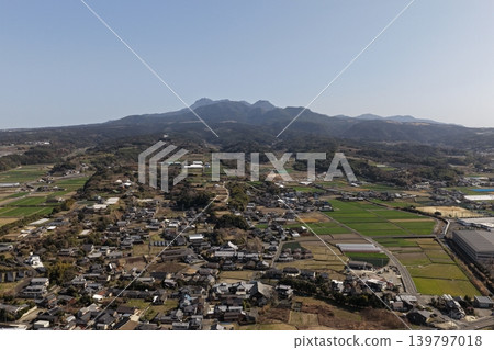 Aerial photograph showing a rural settlement and mountains in Isahaya City, Nagasaki Prefecture. Aerial photograph showing a rural settlement and mountains in Isahaya City, Nagasaki Prefecture. 139797018