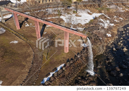 An aerial photograph overlooking Watagataki Falls and a red railway bridge in Hakusan City, Ishikawa Prefecture. An aerial photograph overlooking Watagataki Falls and a red railway bridge in Hakusan City, Ishikawa Prefecture. 139797249