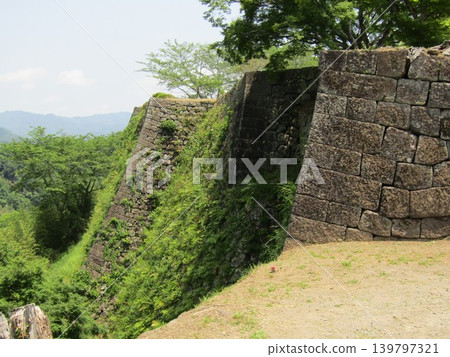 The stone walls of Oka Castle Ruins, a nationally designated historical site and one of Japan's 100 Famous Castles, located in Taketa City, Oita Prefecture, known for Rentaro Taki's song "Kojo no Tsuki" (The Moon over the Ruined Castle). The stone walls of Oka Castle Ruins, a nationally designated historical site and one of Japan's 100 Famous Castles, located in Taketa City, Oita Prefecture, known for Rentaro Taki's song "Kojo no Tsuki" (The Moon over the Ruined Castle). 139797321