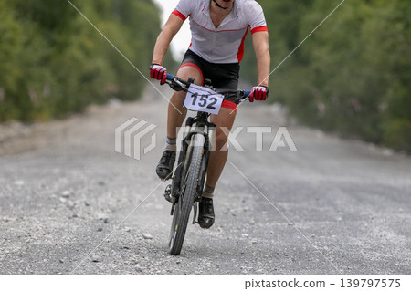 Participant in one-day mountain bike race Participant in one-day mountain bike race 139797575