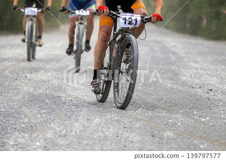 Three participants of mountain bike race Three participants of mountain bike race 139797577
