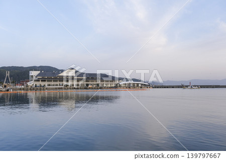 Sumoto Port at dusk, with calm waves. Sumoto Port at dusk, with calm waves. 139797667