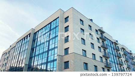 Architecture and real estate, modern residential apartment building with panoramic windows Architecture and real estate, modern residential apartment building with panoramic windows 139797724