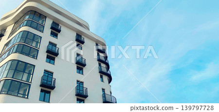 Architecture and real estate, modern residential apartment building with panoramic windows Architecture and real estate, modern residential apartment building with panoramic windows 139797728