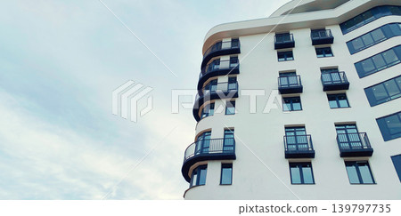 Architecture and real estate, modern residential apartment building with panoramic windows Architecture and real estate, modern residential apartment building with panoramic windows 139797735