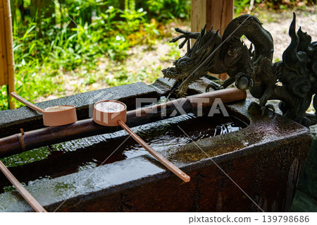 A ladle placed in the chozuya of a shrine A ladle placed in the chozuya of a shrine 139798686