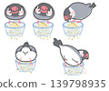 A set of silver finches that eat food from a glass bowl. 139798935