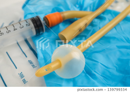 Foley urinary catheter with urine bag for disability or patient in hospital. Foley urinary catheter with urine bag for disability or patient in hospital. 139799334