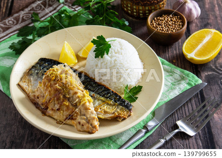 Grilled baked mackerel in ginger mustard honey sauce stuffed with vegetables and cheese on a rustic tabletop. Grilled baked mackerel in ginger mustard honey sauce stuffed with vegetables and cheese on a rustic tabletop. 139799655