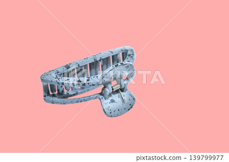 Plastic hair claw clip with speckled print. 139799977