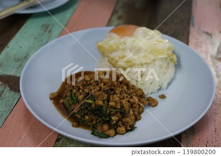 Plate of Rice with Fried Egg and Minced Meat Dish 139800200