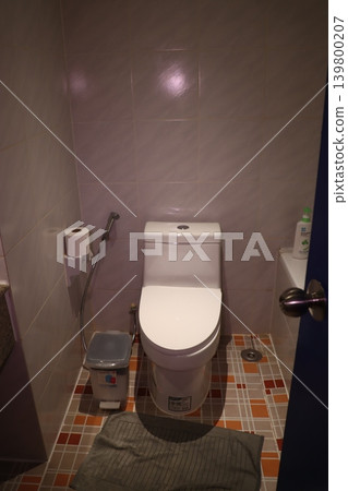 Bathroom Interior with Toilet and Tile Walls Bathroom Interior with Toilet and Tile Walls 139800207