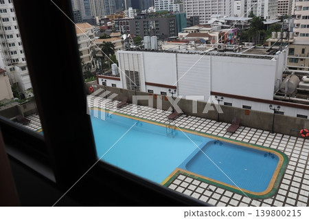 Urban Rooftop Pool with Cityscape View Urban Rooftop Pool with Cityscape View 139800215