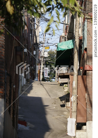 Urban Alley with Overhead Wires and Buildings 139800219