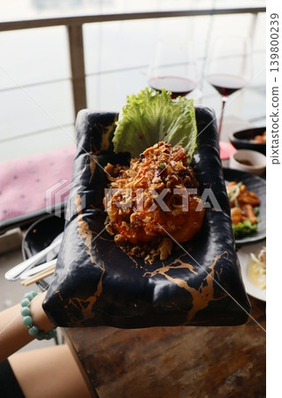 Delicious Meal on Black Plate with Lettuce Delicious Meal on Black Plate with Lettuce 139800239