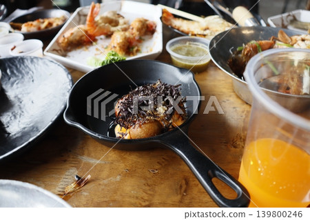 Diverse Seafood and Appetizers on Wooden Table Diverse Seafood and Appetizers on Wooden Table 139800246