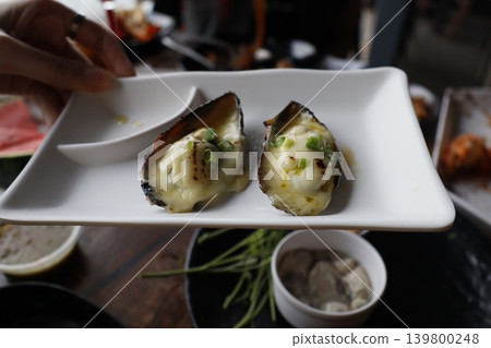 Oysters with Cream and Scallions on White Plate Oysters with Cream and Scallions on White Plate 139800248