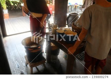 Traditional Cooking Scene with Two People Traditional Cooking Scene with Two People 139800274