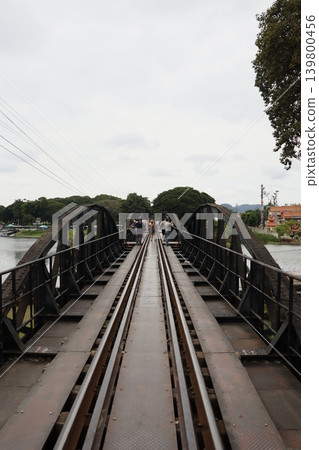 Railway Bridge with Pedestrians Over Water Railway Bridge with Pedestrians Over Water 139800456