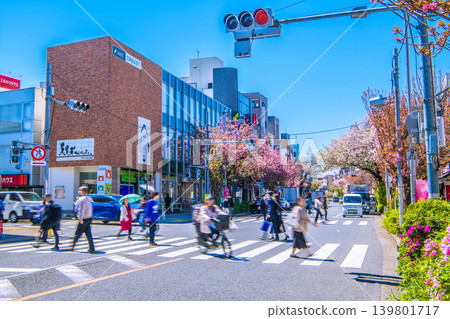 Tokyo cityscape, April. View of the area in front of Sakurashinmachi Station on the Tokyu Railway line, including cherry blossoms. A bicycle... = April 8th Tokyo cityscape, April. View of the area in front of Sakurashinmachi Station on the Tokyu Railway line, including cherry blossoms. A bicycle... = April 8th 139801717