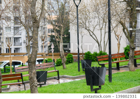 Cozy urban square with benches and trash bins in Saburtalo, Tbilisi Cozy urban square with benches and trash bins in Saburtalo, Tbilisi 139802331