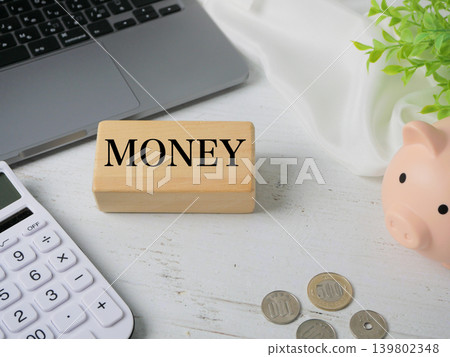 Financial items inspired by money, including a calculator, a piggy bank, and coins. Financial items inspired by money, including a calculator, a piggy bank, and coins. 139802348