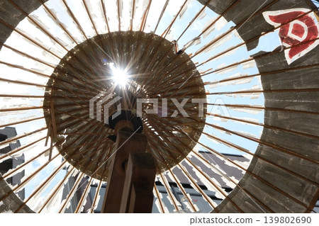 Summer sunlight on a Japanese umbrella at Hakurakuten Mountain Summer sunlight on a Japanese umbrella at Hakurakuten Mountain 139802690