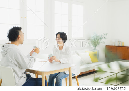 A couple drinking coffee A couple drinking coffee 139802722