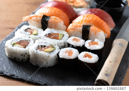 Fresh sushi assortment with salmon maki and nigiri Fresh sushi assortment with salmon maki and nigiri 139802887