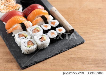 Fresh sushi assortment with salmon maki and nigiri Fresh sushi assortment with salmon maki and nigiri 139802888