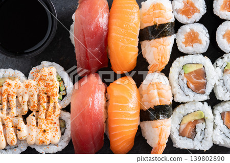 Fresh sushi assortment with salmon maki and nigiri Fresh sushi assortment with salmon maki and nigiri 139802890