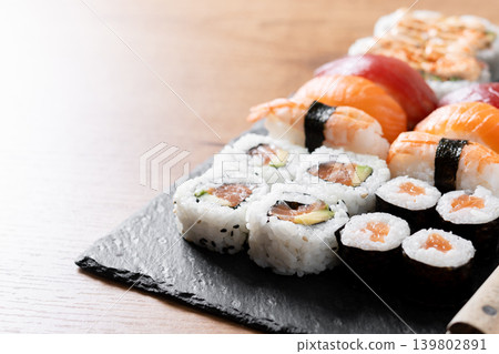 Fresh sushi assortment with salmon maki and nigiri Fresh sushi assortment with salmon maki and nigiri 139802891