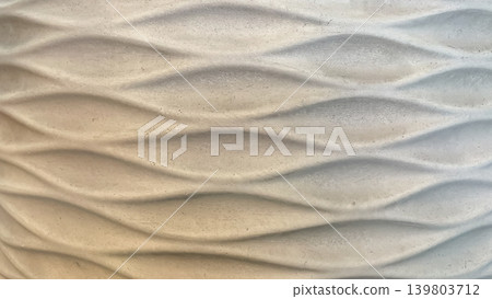 Abstract background of a concrete surface with elegant wavy geometric relief patterns and soft shadows Abstract background of a concrete surface with elegant wavy geometric relief patterns and soft shadows 139803712