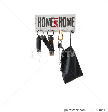 a key holder hanging on the wall with keys a key holder hanging on the wall with keys 139803841