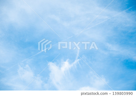 Beautiful Blue Sky Background with Airplane Contrail Line, Vapor Trail and White Fluffy Clouds Beautiful Blue Sky Background with Airplane Contrail Line, Vapor Trail and White Fluffy Clouds 139803990