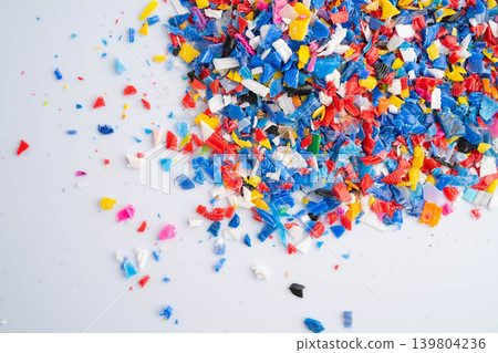Plastic colorful pieces recycling shredded for industrial use. Plastic colorful pieces recycling shredded for industrial use. 139804236